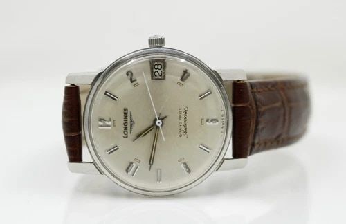 VINTAGE LONGINES GRAND PRIZE AUTOMATIC 34MM DATE DIAL STAINLESS STEEL WATCH: VINTAGE LONGINES GRAND PRIZE AUTOMATIC 34MM DATE DIAL STAINLESS STEEL WATCH VINTAGE LONGINES GRAND PRIZE AUTOMATIC 34MM DATE DIAL STAINLESS STEEL WATCH Description Vintage Longines Grand Prize Automat