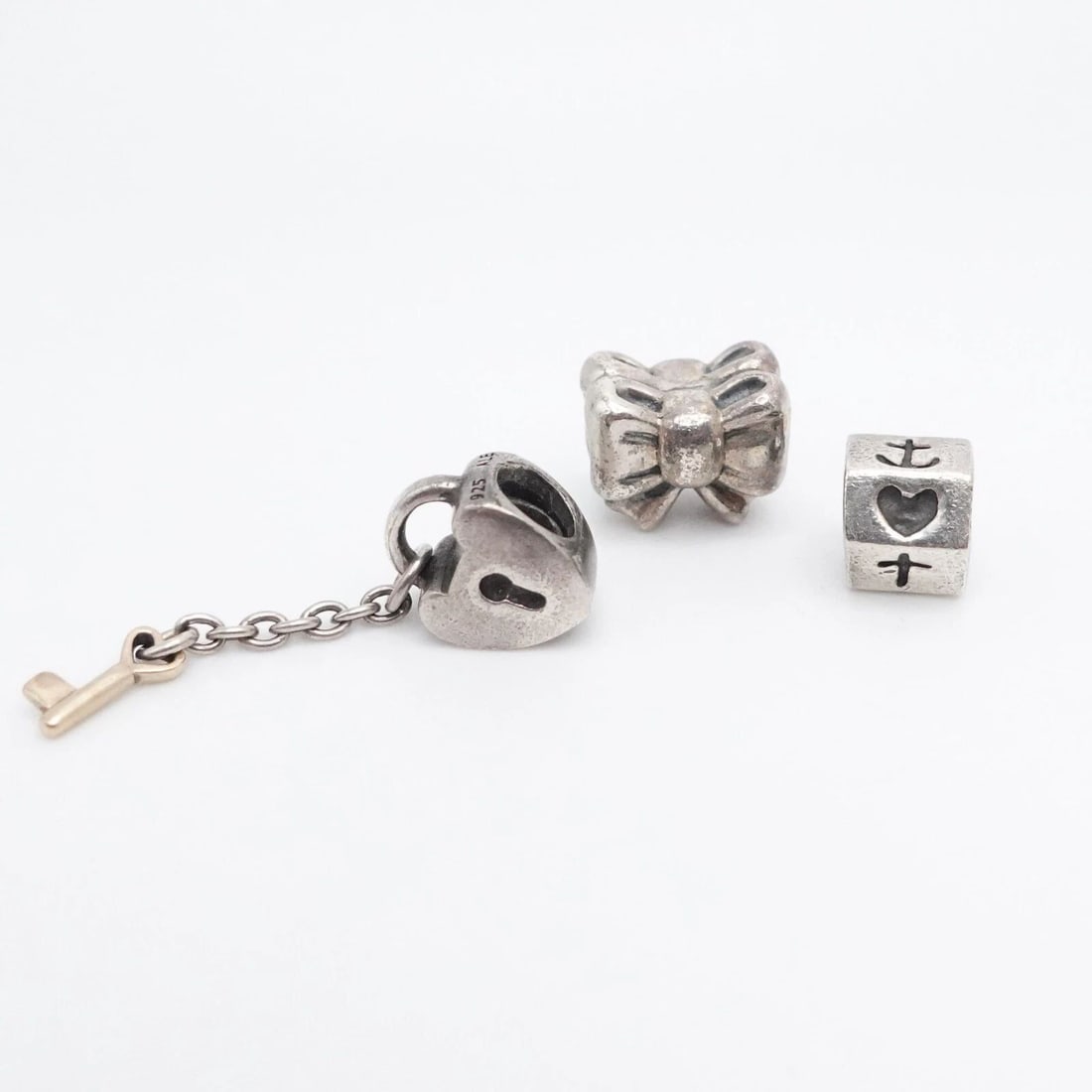 AUTHENTIC PANDORA STERLING SILVER KEY TO MY HEART GIFT BOW & ANCHOR BEAD CHARM: PANDORA STERLING SILVER KEY TO MY HEART GIFT BOW & ANCHOR RETIRED BEAD CHARMS Authentic Pandora Sterling Silver Lots of 3 Key To My Heart & Gift Bow Retired Bead Charms Style # 790288, 791204, 790119