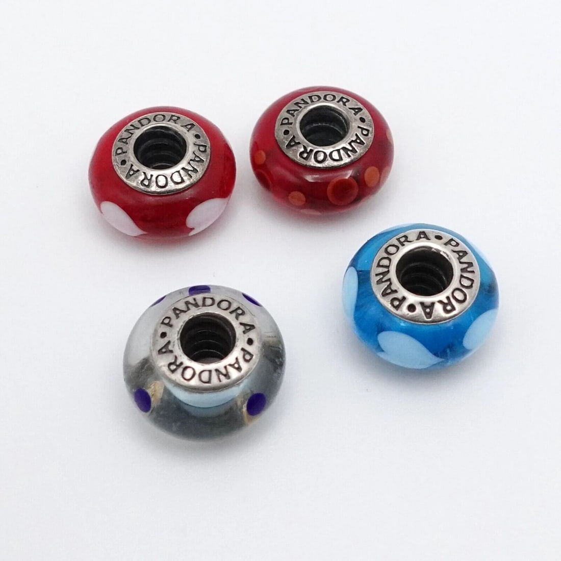AUTHENTIC PANDORA STERLING SILVER 4 RED & BLUE MURANO GLASS CHARMS: PANDORA STERLING SILVER LOTS OF 4 RED AND BLUE MURANO GLASS BEAD CHARMS Authentic Pandora Sterling Silver Lots of 4 Red and Blue Murano Glass Bead Charm