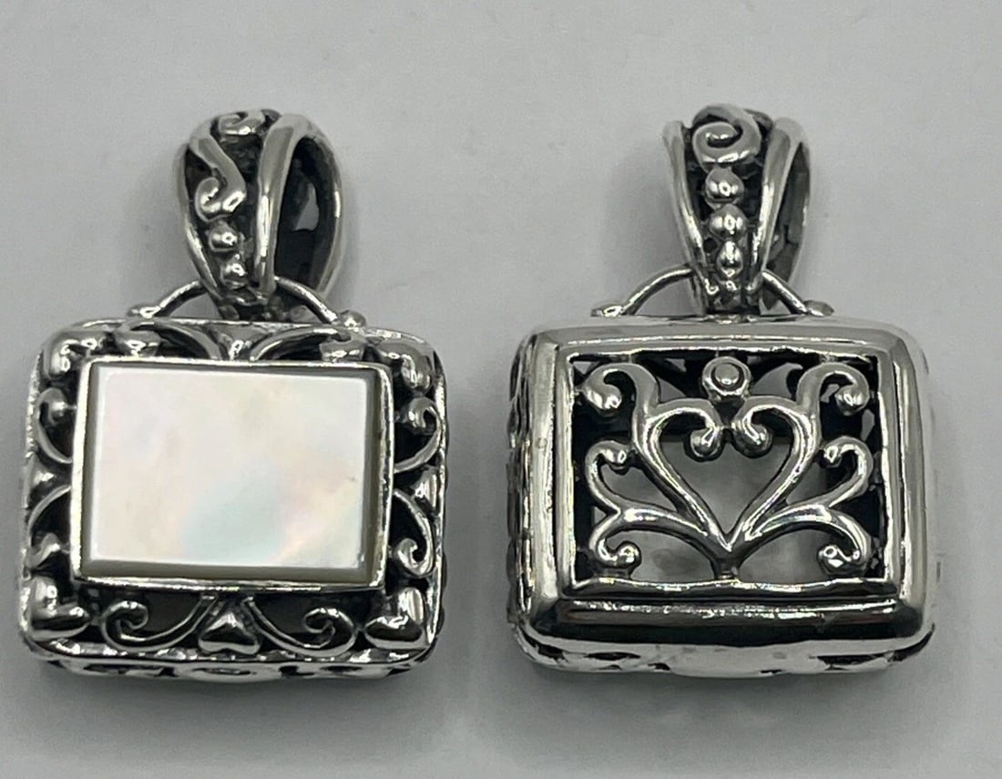 MOTHER OF PEARL & STERLING SILVER PENDANT: MOTHER OF PEARL & STERLING SILVER PENDANT MOTHER OF PEARL & STERLING SILVER PENDANT This pendant is crafted from sterling silver with a stunning mother of pearl or abalone stone as the main feature. T