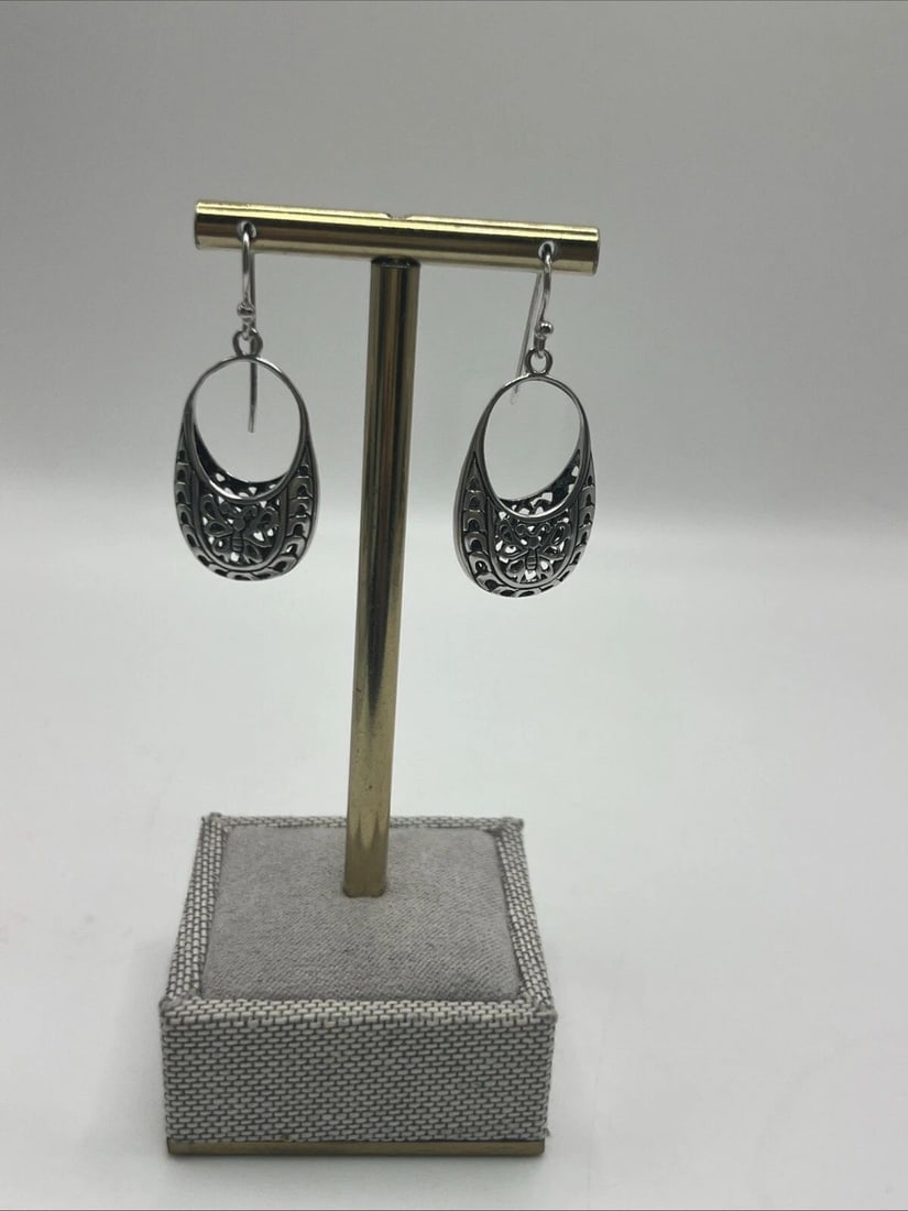 FILIGREE LOCK STYLE STERLING SILVER DANGLE EARRINGS WITH BUTTERFLY DESIGN: FILIGREE LOCK STYLE STERLING SILVER DANGLE EARRINGS WITH BUTTERFLY DESIGN FILIGREE LOCK STYLE STERLING SILVER DANGLE EARRINGS WITH BUTTERFLY DESIGN These sterling silver dangle earrings feature a fili