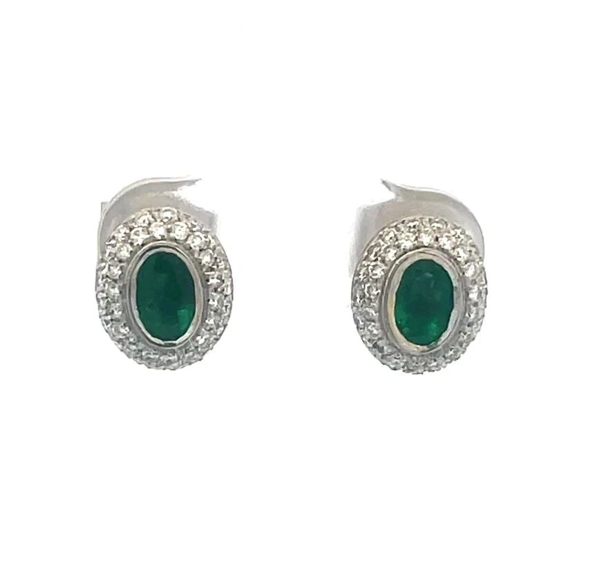 H.STERN EMERALD GOLD EARRINGS PAVE DIAMOND 18K WHITE OVAL STUDS PAPER: Elegant and authentic from H.Stern, these earrings features oval stud designs that exude timeless elegance. Each earring is masterfully crafted from 18k white gold, providing a luxurious backdrop for