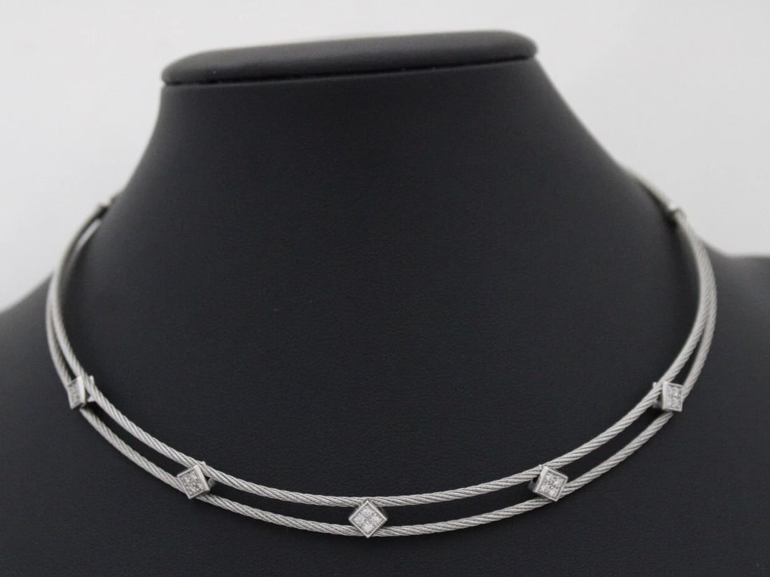 CHARRIOL 18K & STAINLESS STEEL DOUBLE CABLE DIAMOND STATION CHOKER NECKLACE: CHARRIOL 18K & STAINLESS STEEL DOUBLE CABLE DIAMOND STATION CHOKER NECKLACE Description Philippe Charriol 18K White Gold & Stainless Steel Double Cable Kite Set Pave Diamond Station Choker Necklace Ne