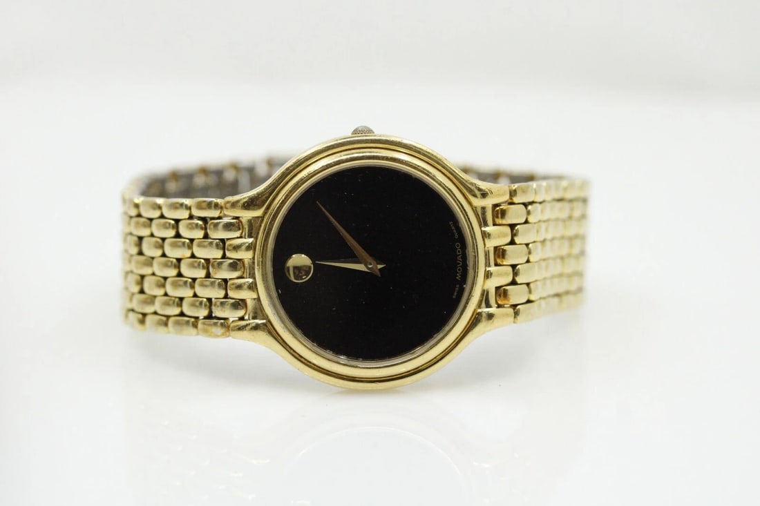 MOVADO MUSEUM 32MM BLACK DIAL QUARTZ GOLD TONED WATCH 87 85 866: MOVADO MUSEUM 32MM BLACK DIAL QUARTZ GOLD TONED WATCH 87 85 866 MOVADO MUSEUM 32MM BLACK DIAL QUARTZ GOLD TONED WATCH 87 85 866 Description MOVADO Museum 32mm Black Dial Quartz Gold Toned Watch 87 85