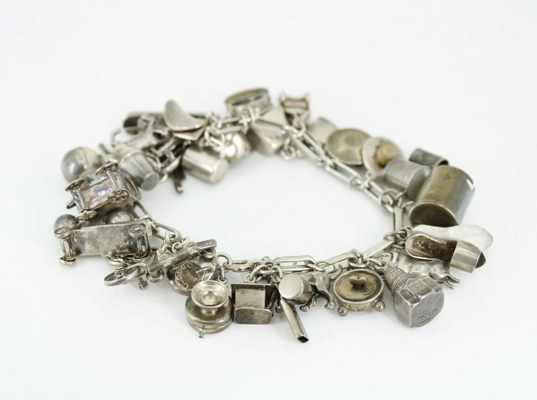 VINTAGE STERLING SILVER 30 CHARM BRACELET WESTERN COWBOY TOYS 7" ~ 58.3 GRAMS: VINTAGE STERLING SILVER 30 CHARM BRACELET WESTERN COWBOY TOYS 7" ~ 58.3 GRAMS VINTAGE STERLING SILVER 30 CHARM BRACELET WESTERN COWBOY TOYS 7" ~ 58.3 GRAMS Description Vintage Sterling Silver 30 Charm