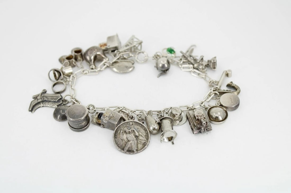 VINTAGE STERLING SILVER 26 CHARM BRACELET WESTERN MILITARY 8" ~ 44.3 GRAMS: VINTAGE STERLING SILVER 26 CHARM BRACELET WESTERN MILITARY 8" ~ 44.3 GRAMS VINTAGE STERLING SILVER 26 CHARM BRACELET WESTERN MILITARY 8" ~ 44.3 GRAMS Description Vintage Sterling Silver 26 Charm Brace