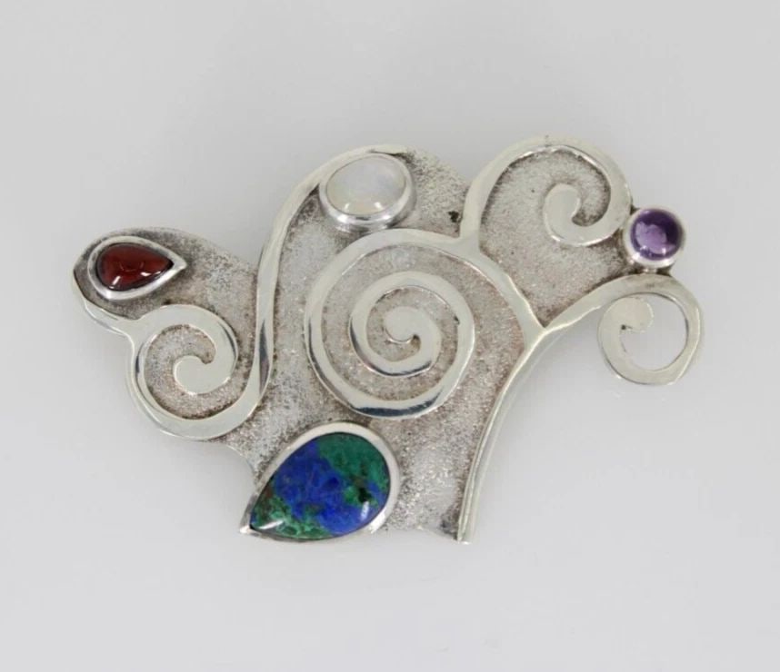 SAJEN STERLING MALACHITE AZURITE, AMETHYST, MOONSTONE & GARNET PENDANT BROOCH: SAJEN STERLING MALACHITE AZURITE, AMETHYST, MOONSTONE & GARNET PENDANT BROOCH SAJEN STERLING MALACHITE AZURITE, AMETHYST, MOONSTONE & GARNET PENDANT BROOCH Description Sajen Sterling Silver Malachite