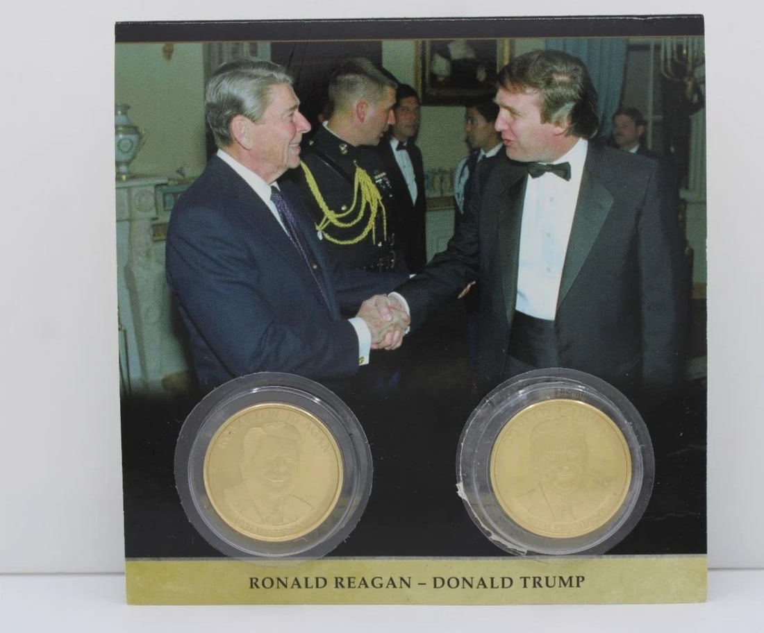PRESIDENT DONALD TRUMP & RONALD REAGAN COMMEMORATIVE COIN SET: PRESIDENT DONALD TRUMP & RONALD REAGAN COMMEMORATIVE COIN SET Description President Donald Trump & Ronald Reagan Commemorative Coin Set Coin/pin are in uncirculated condition. Packaging may show signs