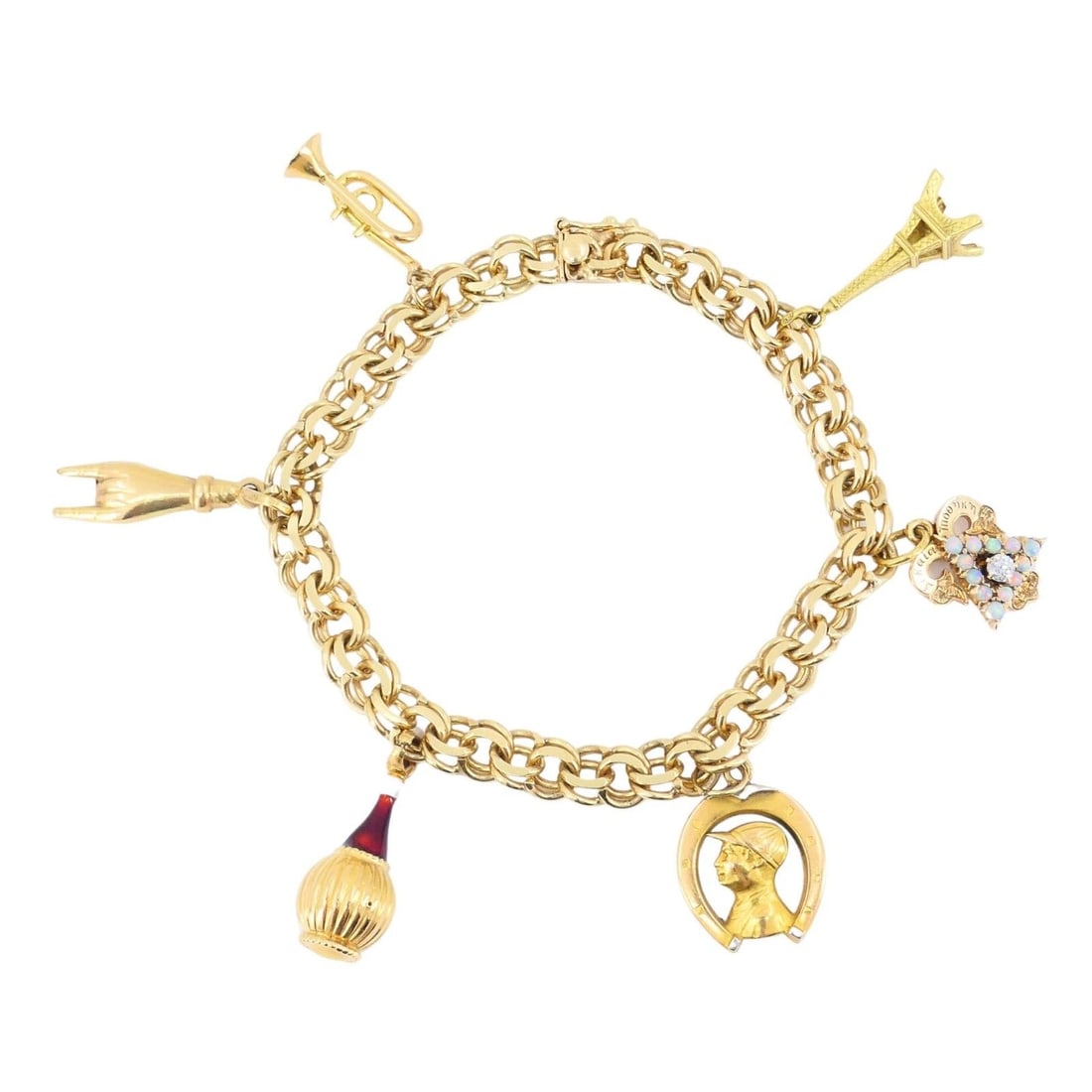 VINTAGE 14K 18K GOLD CHARM BRACELET: VINTAGE 14K 18K GOLD CHARM BRACELET A vintage charm bracelet crafted in 14k and 18k yellow gold, circa 1950s–1960s. This beautifully assembled bracelet captures the nostalgia of mid-century travel a