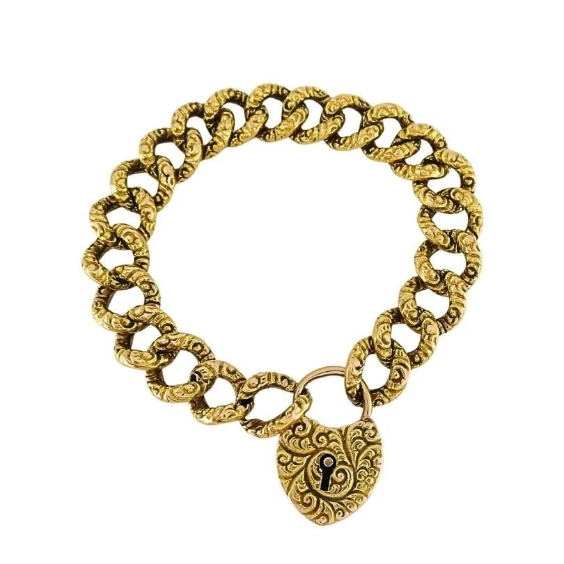 VINTAGE 14K GOLD HEART LOCK LINK BRACELET: VINTAGE 14K GOLD HEART LOCK LINK BRACELET Product details: MATERIALS: 14k Gold WEIGHT: 12 Grams MEASUREMENTS: 3/8" x 6 1/2" ITEM DETAILS: Vintage 14k Gold Heart Lock Link Bracelet This beautifully cra
