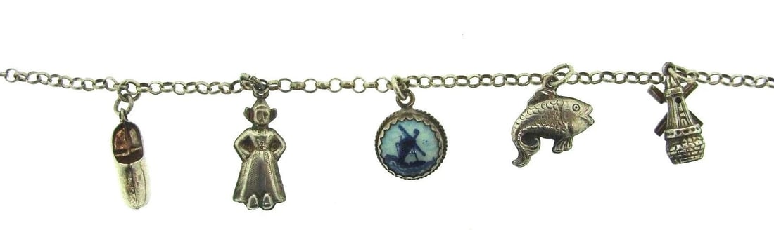 CUTE SILVER & ENAMEL CHARM BRACELET CIRCA 1970S: CUTE SILVER & ENAMEL CHARM BRACELET CIRCA 1970S Silver & Enamel Charm Bracelet Circa 1970s Wonderful bracelet that is a necessity in your collection. The length is 6 3/8 inches. The length of the char