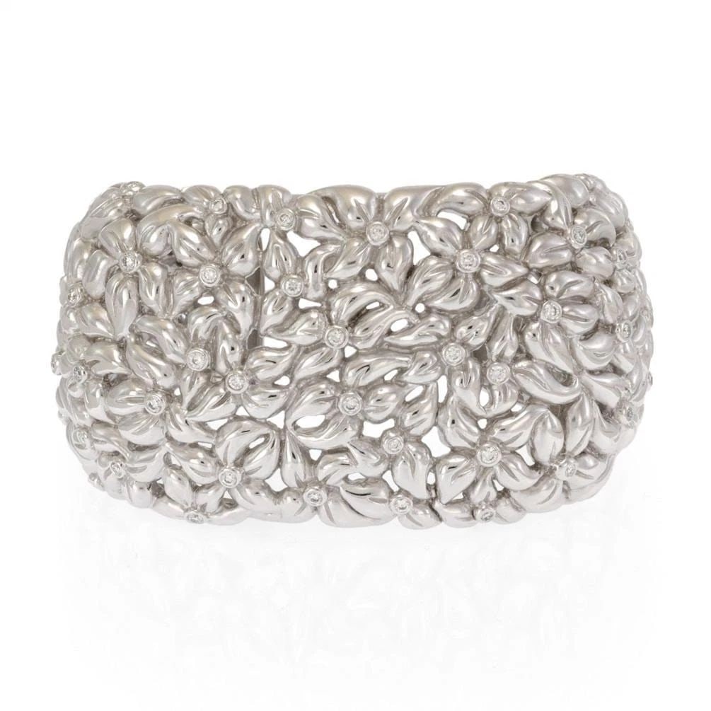 LARGE 1CT DIAMOND 18K WHITE GOLD 41MM WIDE FLORAL CUFF BRACELET 164 GRAMS: LARGE 1CT DIAMOND 18K WHITE GOLD 41MM WIDE FLORAL CUFF BRACELET 164 GRAMS Large 1ct Diamond 18k White Gold 41mm Wide Floral Cuff Bracelet 164 grams Description This is a large magnificent Estate cuff