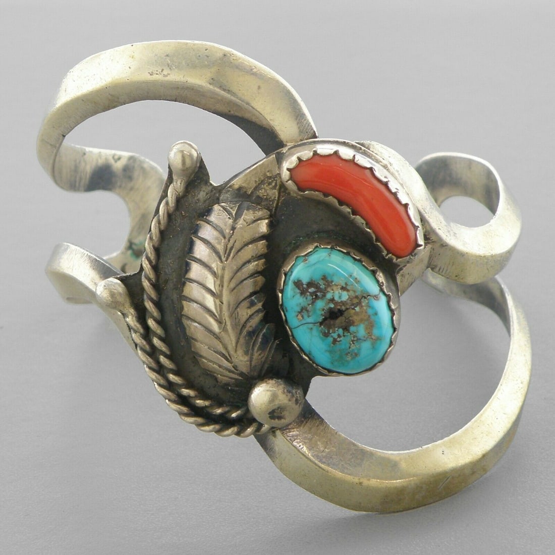 VINTAGE NAVAJO STERLING SILVER TURQUOISE CORAL CUFF: VINTAGE TURQUOISE STERLING SILVER CUFF Vintage Navajo Turquoise & Coral sterling silver cuff bangle Measures 2.41" inside measurement Measures 2.12" Wide in front Vintage, Pre-owned, in good condition