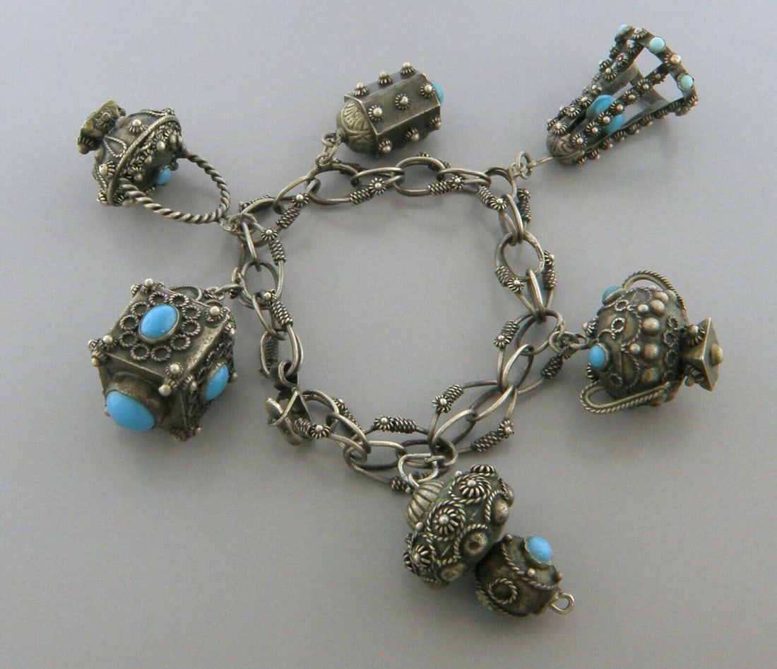 VINTAGE BEAUTIFUL LARGE 800 SILVER TURQUOISE CHARM BRACELET ETRUSCAN: TURQUOISE SILVER BRACELET Turquoise 800 silver Etruscan charm Bracelet Measures 8" Long 6 charms Vintage, Pre-owned, in good condition, minor wear due to age please refer to pics Due to age it has acq