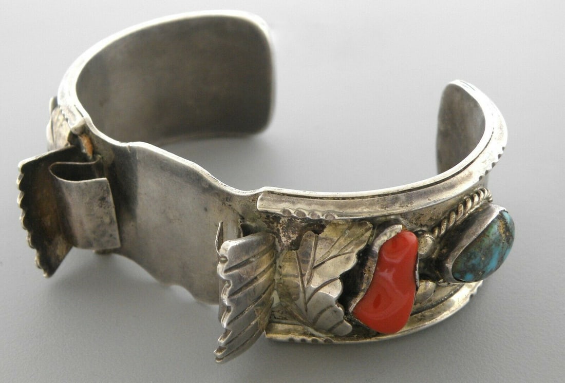 VINTAGE BEAUTIFUL NAVAJO SILVER TURQUOISE CORAL CUFF: VINTAGE TURQUOISE CORAL STERLING SILVER WATCH CUFF Vintage Turquoise & coral sterling silver Navajo watch cuff Measures 2.70" inside length Measures 1.00" wide in front Unisex, will fit upto 7.75" wri
