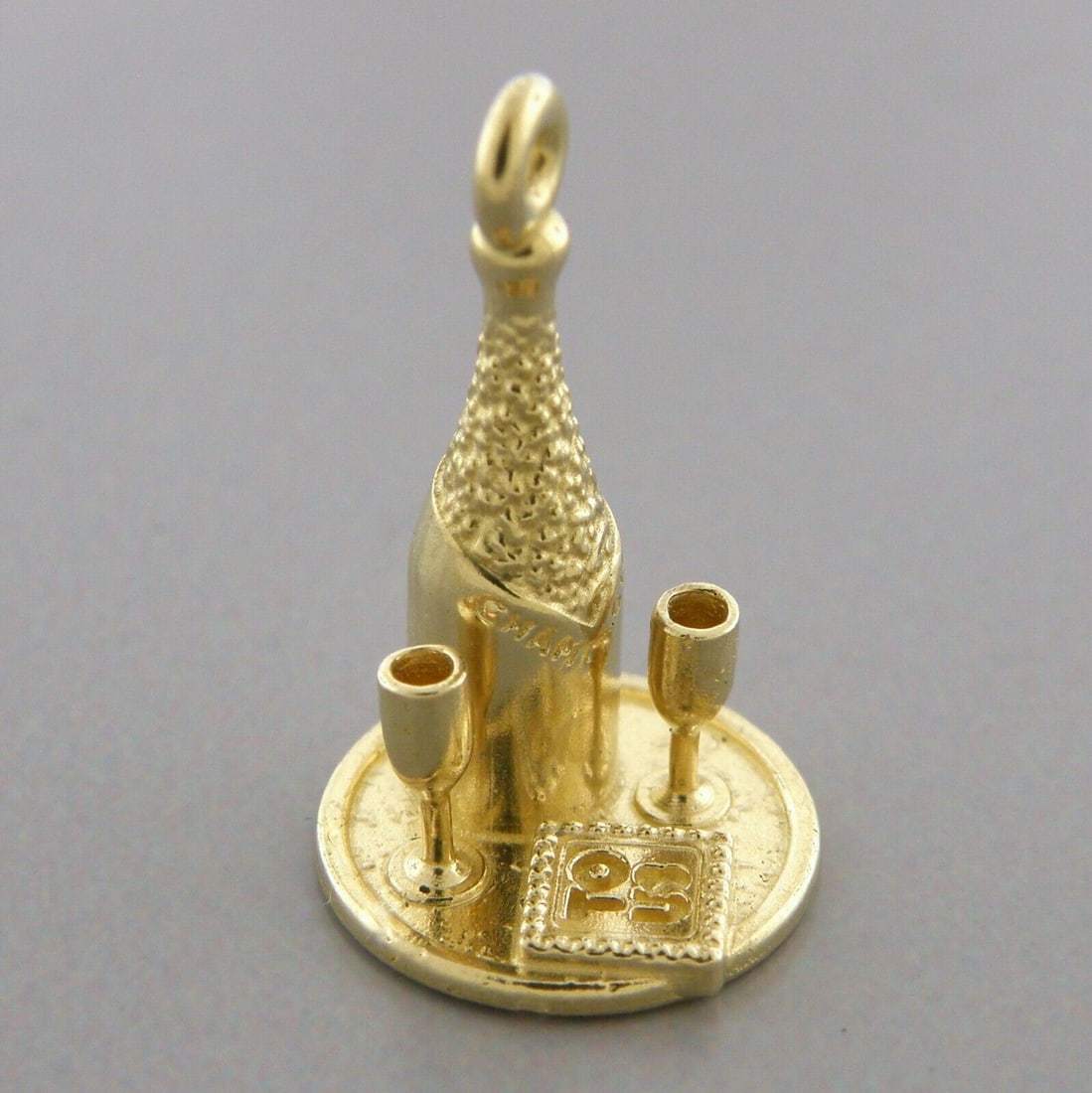 14K YELLOW GOLD CHAMPAGNE TO US CHARM/ PENDANT: 14K YELLOW GOLD CHARM 14K yellow gold champagne on a tray and TO US envelope charm Charm measures 0.73" Long x 0.45" Wide Pre-owned charm is in good condition, please refer to pics Tests 14K gold Tota