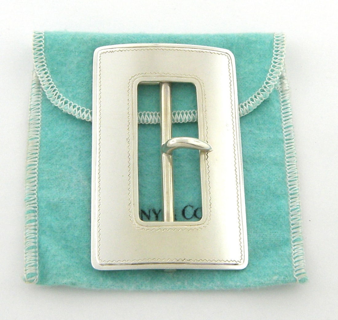 VINTAGE TIFFANY & Co. STERLING SILVER HUGE BELT BUCKLE: VINTAGE TIFFANY & CO. LARGE STERLING SILVER BELT BUCKLE Buckle measures 3" H x 1.87" W Will fit upto 1.85" belt Sterling silver Vintage pre-owned in excellent working condition, minor wear due to age