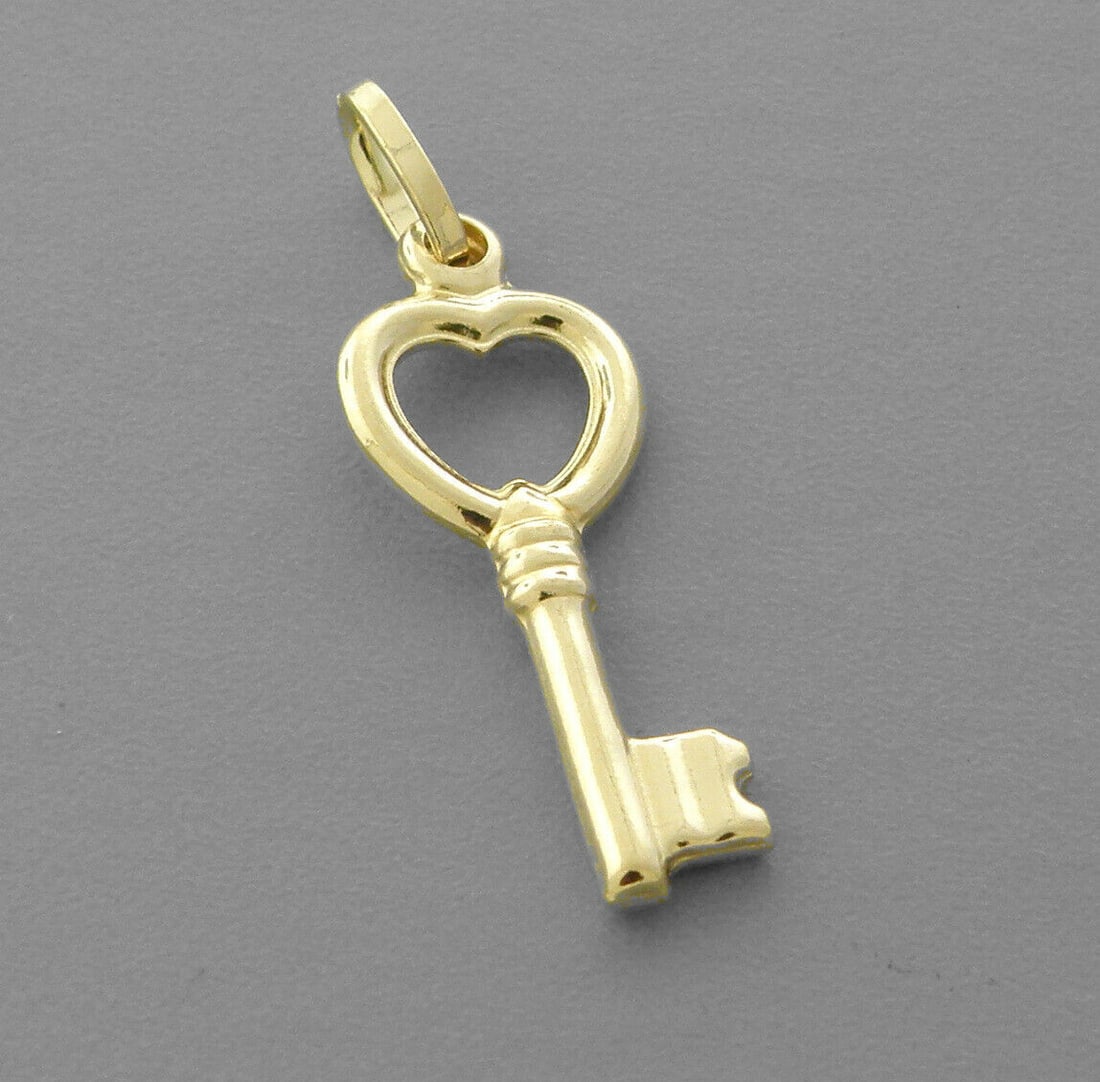NEW 14K YELLOW GOLD HEART KEY PENDANT / CHARM: NEW 14K YELLOW GOLD KEY PENDANT New 14K Yellow Gold Pendant Measures: 5mm x 22mm Pendant has a polished finish Stamp: 14k Apx Weight: 0.9g