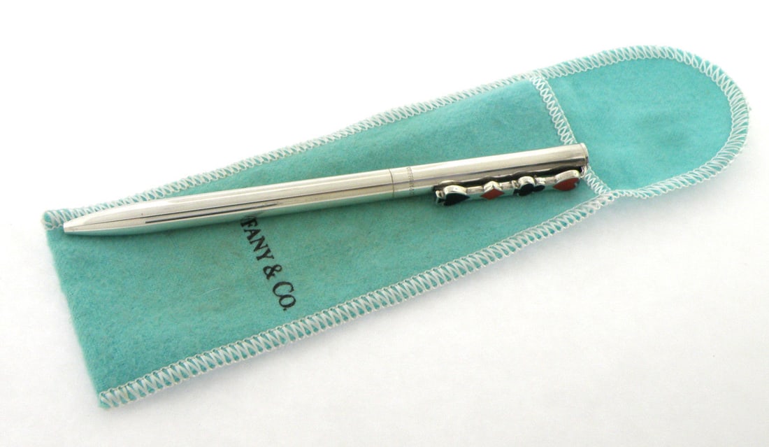 TIFFANY & Co. STERLING SILVER ENAMEL PEN DIAMOND CLUB: TIFFANY & CO. STERLING SILVER ENAMEL PEN Pen measures 5.02" L x 0.31" W Sterling silver enamel pen, with diamond, spade, club and heart design Pre-owned, in good working condition shows minor wear, p