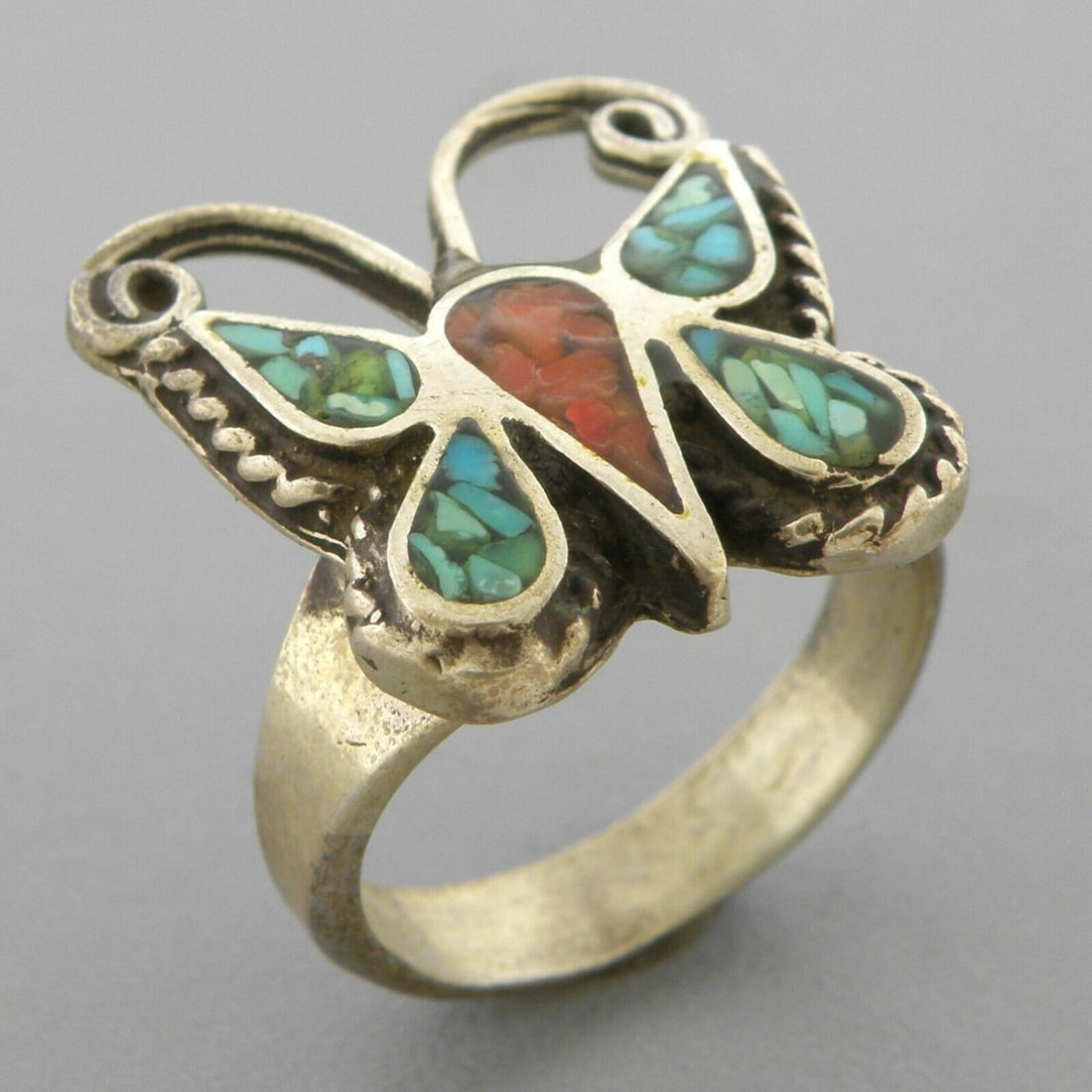 VINTAGE SOUTHWESTERN SILVER CORAL & TURQUOISE RING SZ 5: VINTAGE STERLING SILVER RING Vintage Southwestern coral & Turquoise sterling silver butterfly ring Size 5 Ring Measures 0.71" H x 0.69" W on top Vintage, Pre-owned, in good condition for its age, plea