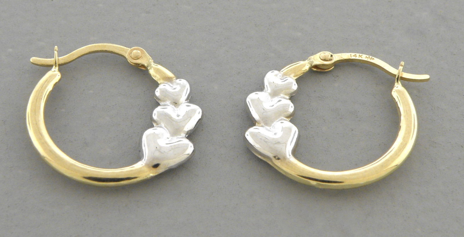 NEW 14K GOLD LADIES GIRL HEART SHRIMP HEART EARRINGS: NEW 14K TWO TONE GOLD EARRINGS New 14K Two tone Gold Earrings Measures: 15mm in diameter Hollow Shrimp Earrings with clasp backing Earrings have a polished finish Light Stamp: 14k Weight: 0.5g