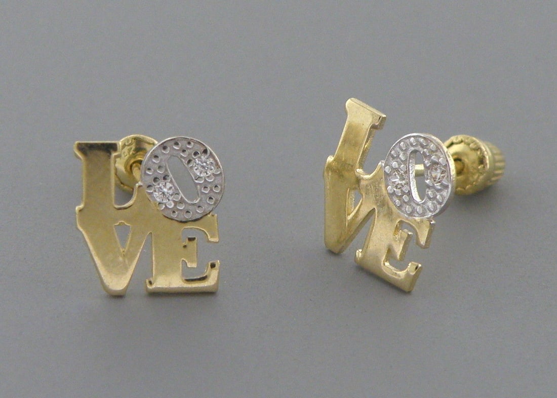 NEW 14K YELLOW GOLD CZ GIRLS BABY STUD LOVE EARRINGS: Earrings measure 7mm W x 7.3mm H 14K Yellow gold, cz LOVE earrings Screw backs New Stamped 14K on earrings and earring backs Total weight 0.6 grams
