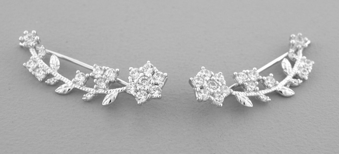 14K WHITE GOLD LADIES FANCY CRAWLER FLOWER BRANCH CZ: NEW 14K WHITE GOLD EARRINGS New 14K White Gold Earrings Measures: 8mm Wide x 28mm Long Flower Crawler Earrings Set with CZ Earrings has a polished finish Stamp: 14k Avg Weight: 2.7g