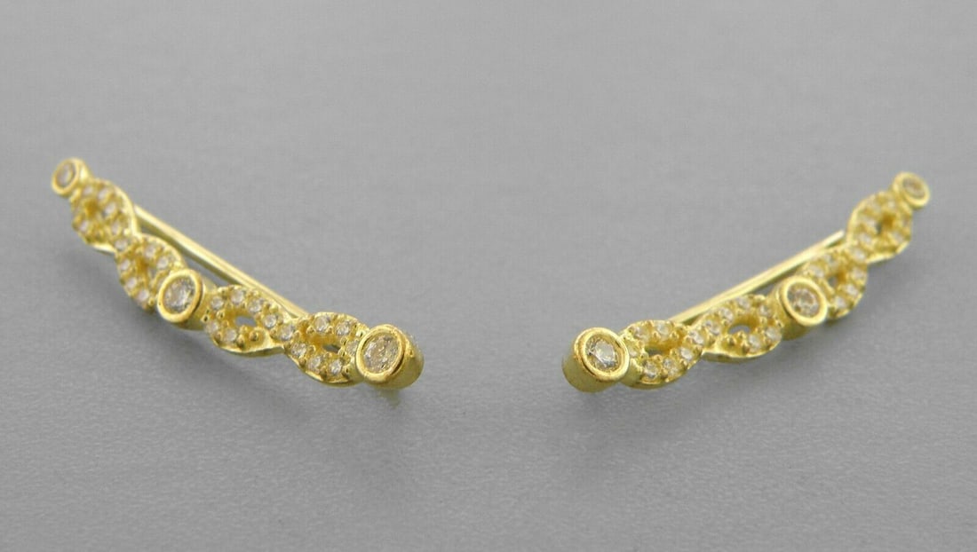 14K YELLOW GOLD LADIES FANCY CRAWLER CZ INFINITY: NEW 14K YELLOW GOLD EARRINGS New 14K Yellow Gold Earrings Measures: 3.5mm Wide x 18mm Long Infinity style Crawler Earrings Set with CZ Earrings has a polished finish Stamp: 14k Avg Weight: 1.2g