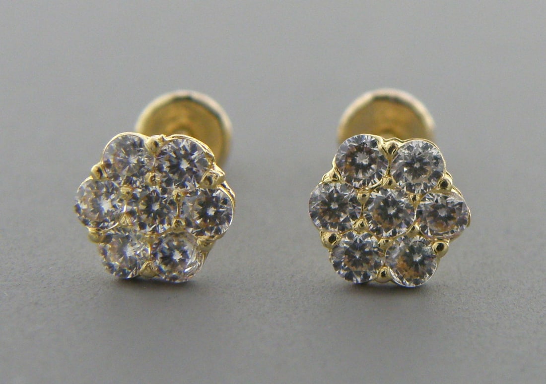 NEW 14K Y/ GOLD CZ BABY STUD CLUSTER FLOWER EARRINGS: Earrings measure 6mm wide in front 14K Yellow gold, cz cluster earrings Screw backs New Stamped 14K on earrings and earring backs Total weight 0.7 grams