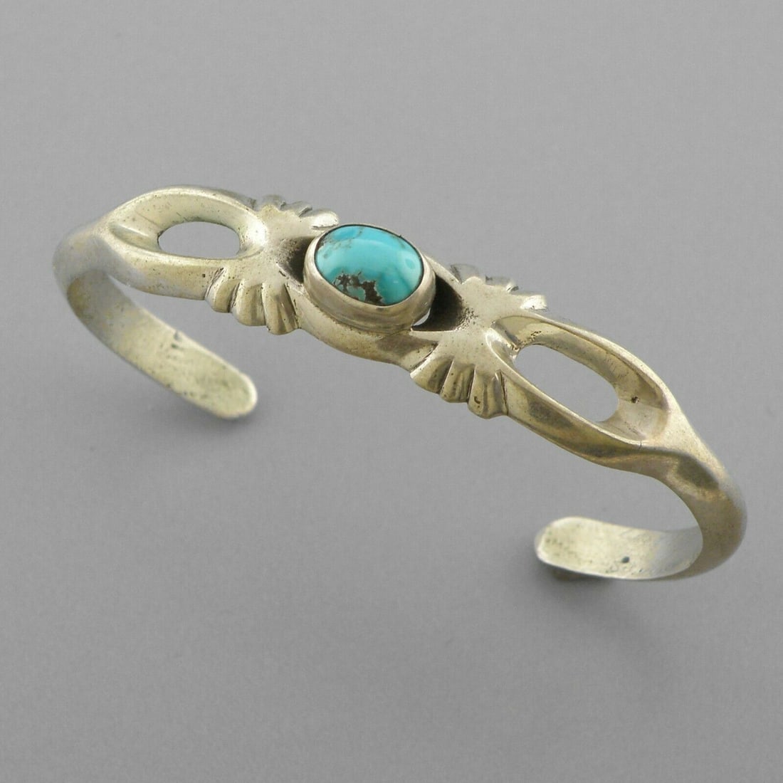 VINTAGE BEAUTIFUL NAVAJO STERLING SILVER TURQUOISE CUFF: VINTAGE TURQUOISE STERLING SILVER CUFF Vintage Navajo Turquoise sterling silver cuff bangle Measures 2.33" inside measurement Measures 0.44" Wide in front Vintage, Pre-owned, in good condition for its