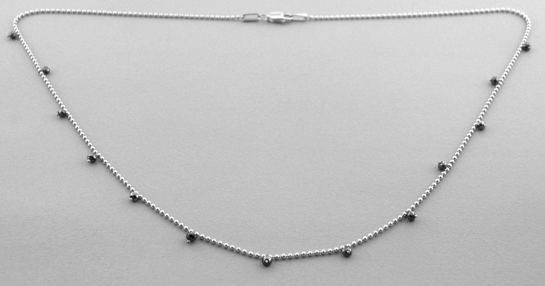 14K W/ GOLD BLACK DIAMOND BY THE YARD NECKLACE 1.25ct: 14K WHITE GOLD DIAMOND BY THE YARD NECKLACENecklace measures 16" Long 14K white gold13 Black Diamonds, Total weight 1.25ctNewStamped 585Total weight 2.7 grams
