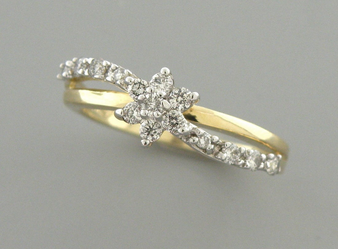 14K YELLOW GOLD DIAMOND FLOWER GIRLS LADIES RING 0.30CT: LADIES 14K YELLOW GOLD DIAMOND RING SIZE 5.25Ring size is a 5.25 (can easily be resized by your local jeweler)Ring head measures 6.4mm wide14K yellow gold set with diamonds15 Diamonds, 0.02ct each, To