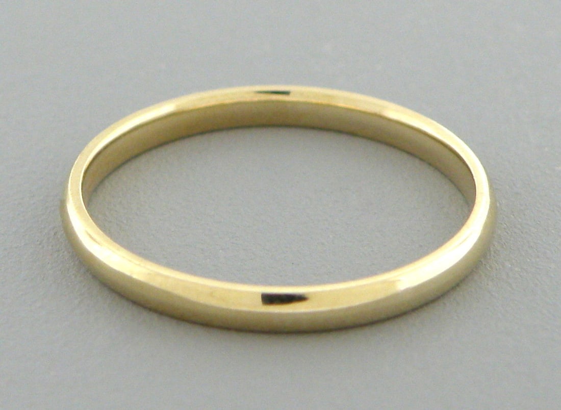 14K YELLOW SOLID GOLD 2MM COMFORT BAND WEDDING RING 4: Size 4Band measures 2mm wide14K Yellow gold Comfort fit Wedding band, smooth and rounded inside the band to make it more comfortable on the finger for everyday wear.Solid gold and thick, not lightweig