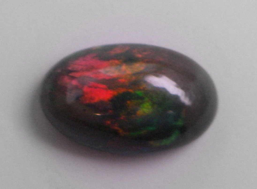 3.60ct AFRICAN BLACK OPAL OVAL CABOCHON CUT NATURAL (1 of 2)
