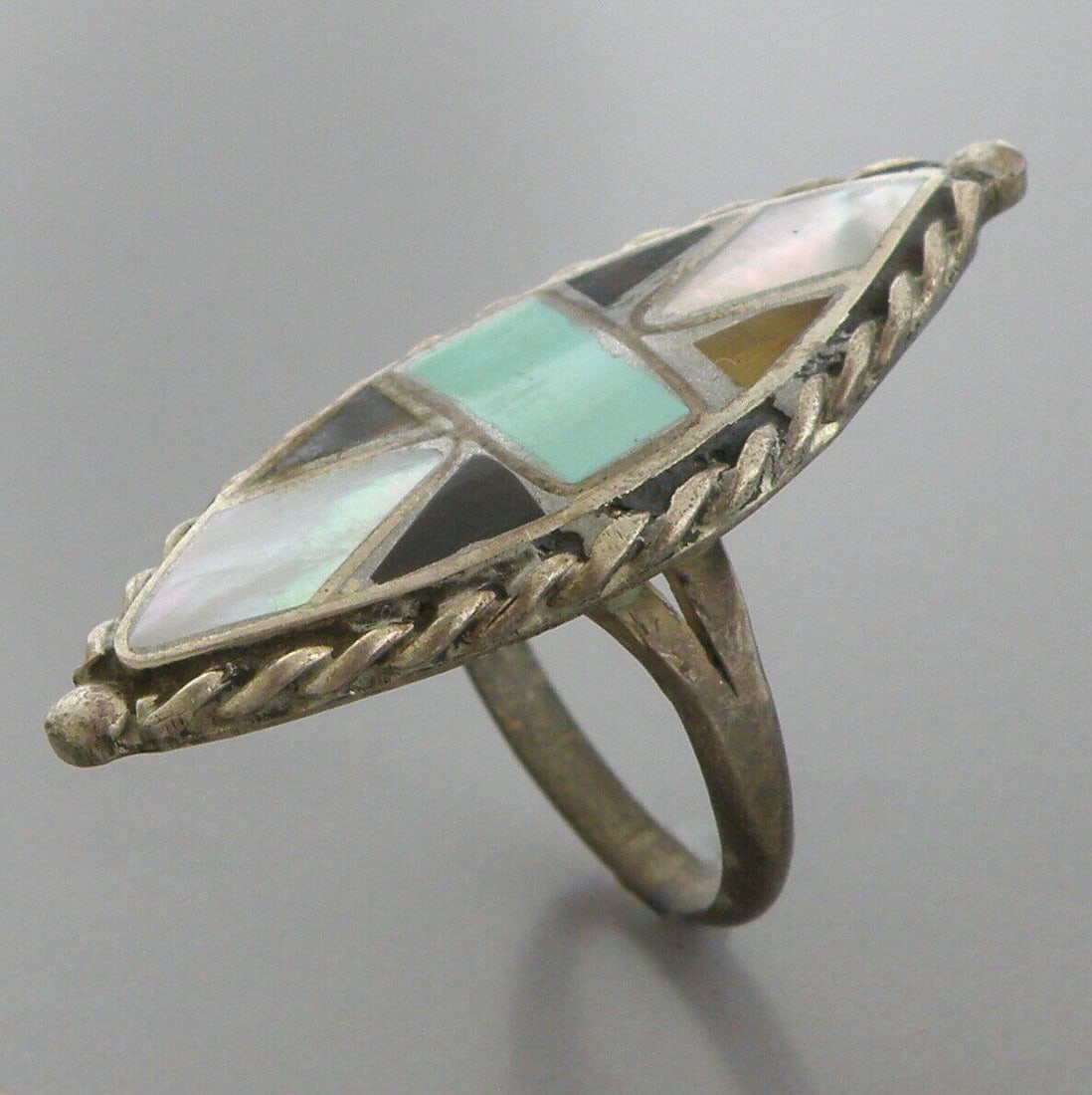 VINTAGE SOUTHWESTERN STERLING SILVER MOP TURQUOISE RING: VINTAGE STERLING SILVER RING Vintage Southwestern Mop, tiger eye & Turquoise sterling silver ring Size 6 Ring Measures 1.45" H x 0.61" W in front Vintage, Pre-owned, in good condition for its age, ple