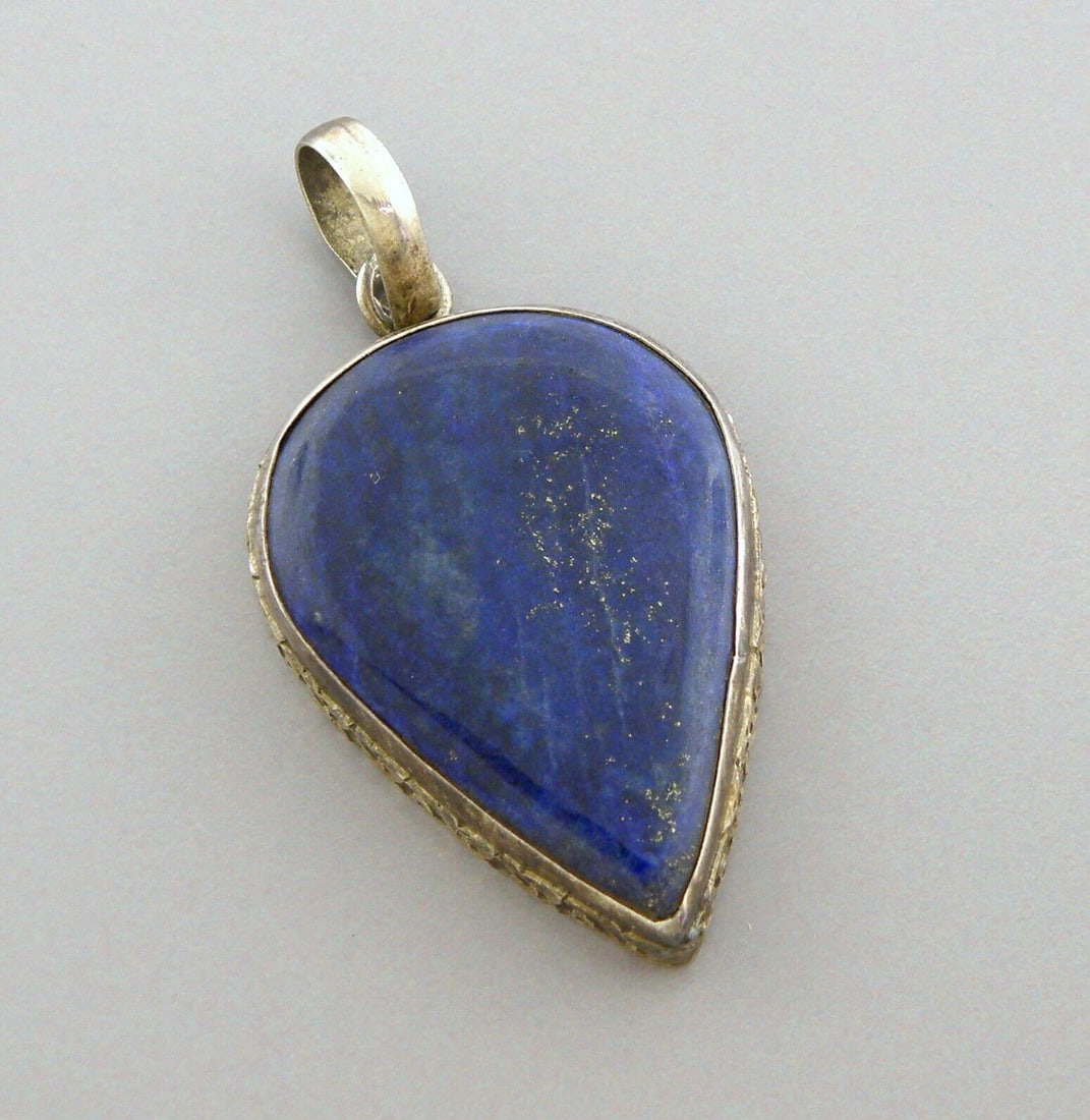 VINTAGE STERLING SILVER LARGE LAPIS LAZULI PEAR SHAPE PENDANT: VINTAGE STERLING SILVER PENDANT Sterling silver lapis lazuli pendant Beautiful blue and gold colored gemstone Measures 1.57" Long x 1.13" Wide Vintage, Pre-owned, in good condition for its age, please