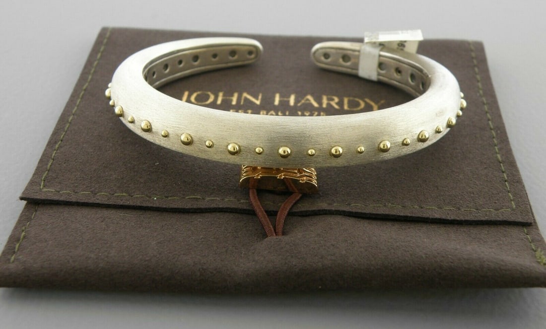 JOHN HARDY 18K GOLD STERLING SILVER DOT HINGED CUFF: JOHN HARDY 18K GOLD STERLING SILVER CUFF Cuff will fit upto 7.25" wrist Width is 0.39" at the widest New with tag John Hardy 18k yellow gold brushed Sterling silver hinged cuff bangle Stamped JH 925 1