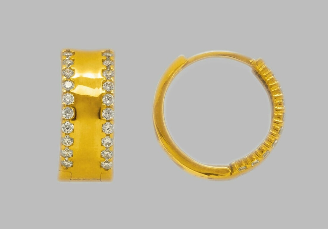 14K YELLOW GOLD LADIES ROUND CZ HUGGIE HOOP EARRINGS: NEW 14K YELLOW GOLD HUGGIE EARRINGS New 14K Yellow Gold Hoop Earrings Measures: 14mm in Diameter x 5.5mm Wide Earrings have a polished finish Set with Cubic Zirconia Snap closure Stamp: 14k Avg Weight