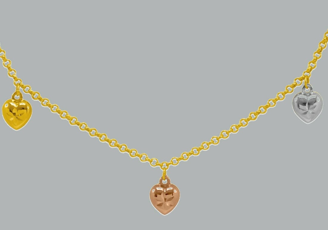 14K TRI COLOR GOLD LADIES FANCY CHARM HEART NECKLACE: NEW 14K TRI COLOR GOLD FANCY HEART NECKLACE New 14K Tri color Gold chain necklace Measures: 18" Long Hearts measures 10mm Polished finish Lobster clasp Stamp: 14k Apx Weight: 4.3g