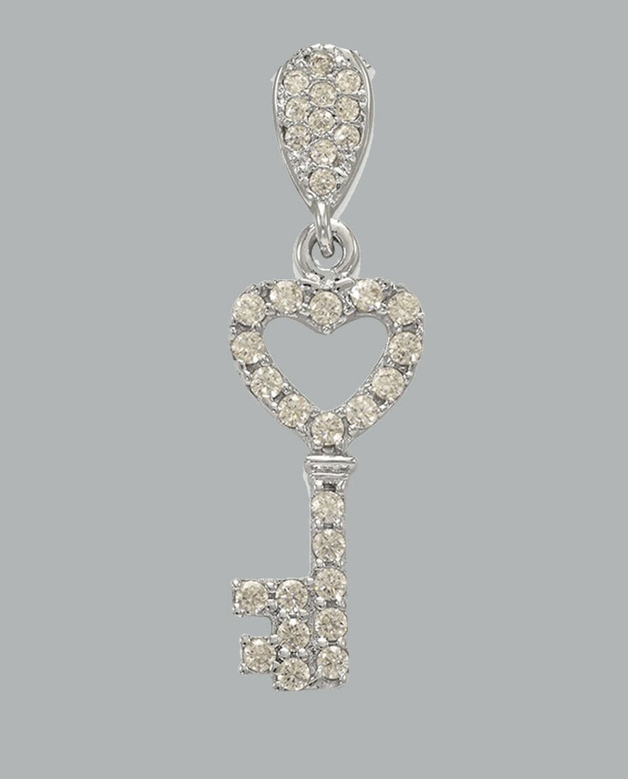 NEW 14K WHITE GOLD CZ FANCY CHARM PENDANT KEY HEART: NEW 14K WHITE GOLD CZ KEY PENDANT New 14K White Gold pendant Pendant measures 8x19mm Set with cubic zirconia Polished finish Stamp: 14k Apx Weight: 1.2g