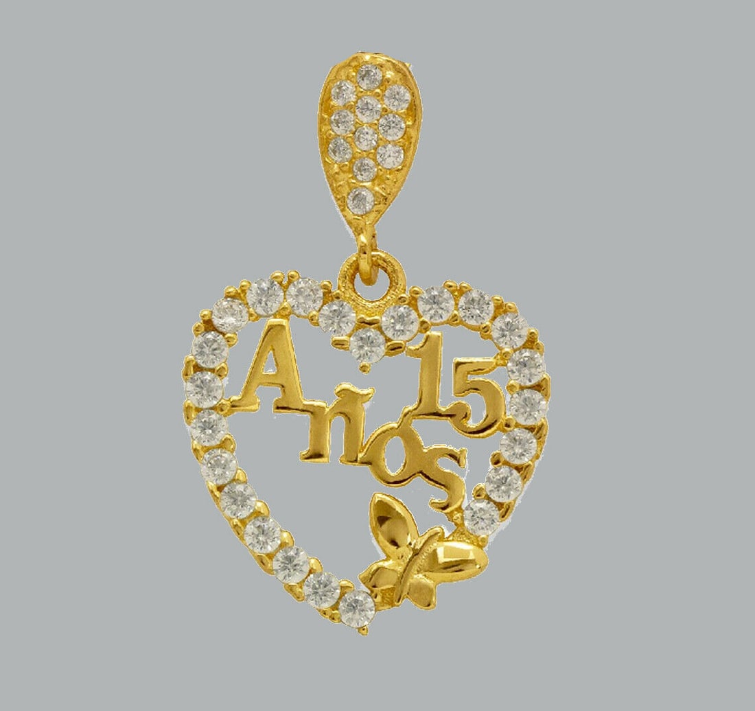 14K YELLOW GOLD CZ FANCY CHARM PENDANT 15 ANOS HEART: NEW 14K YELLOW GOLD 15 ANOS CZ PENDANT New 14K Yellow Gold pendant Pendant measures 15mm x 16mm Set with cubic zirconia Polished finish Stamp: 14k Apx Weight: 1.3g