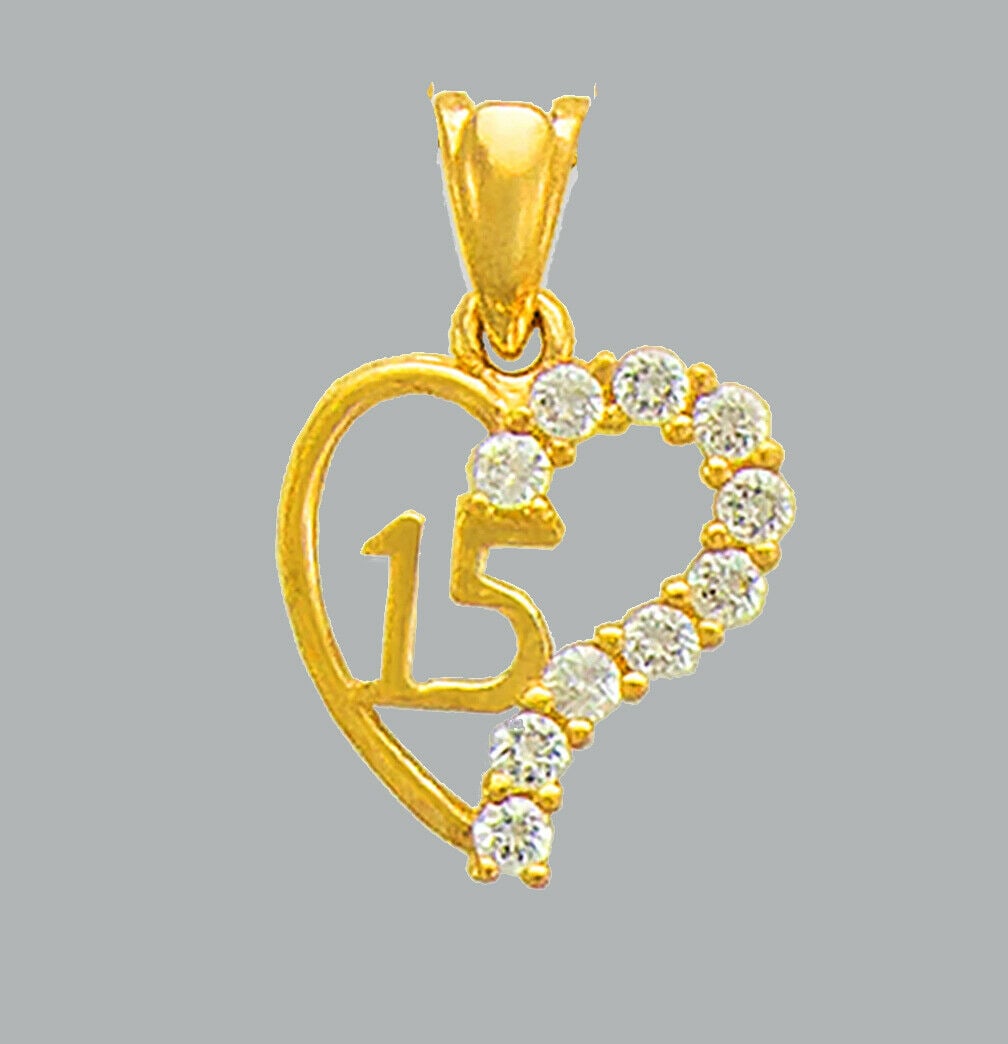 14K YELLOW GOLD CZ FANCY CHARM PENDANT HEART 15 ANOS: NEW 14K YELLOW GOLD CZ HEART PENDANT New 14K Yellow Gold pendant Heart measures 11x12mm Set with cubic zirconia Polished finish Stamp: 14k Apx Weight: 1.2g