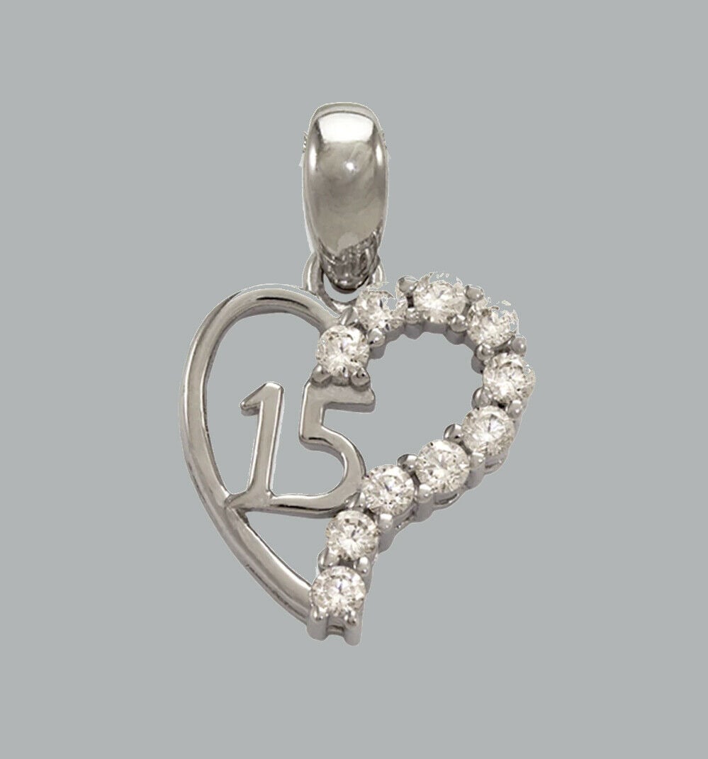 14K WHITE GOLD RED CZ FANCY CHARM PENDANT HEART 15 ANOS: NEW 14K WHITE GOLD CZ HEART PENDANT New 14K WHITE Gold pendant Heart measures 11x12mm Set with cubic zirconia Polished finish Stamp: 14k Apx Weight: 1.2g