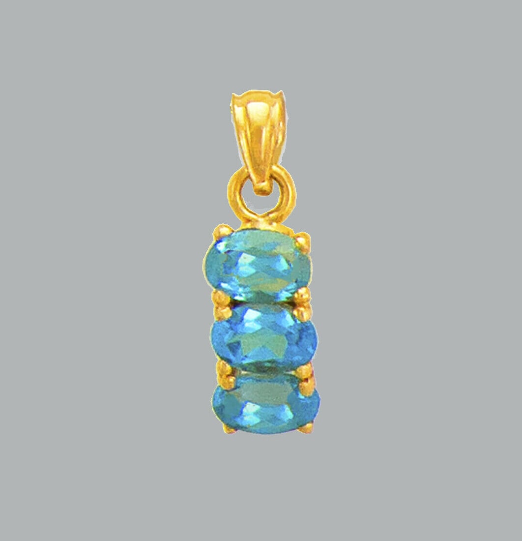 NEW 14K YELLOW GOLD OVAL CZ FANCY CHARM PENDANT BLUE: NEW 14K YELLOW GOLD CZ PENDANT New 14K Yellow Gold pendant Pendant measures 6x12mm Set with cubic zirconia Polished finish Stamp: 14k Apx Weight: 1.2g