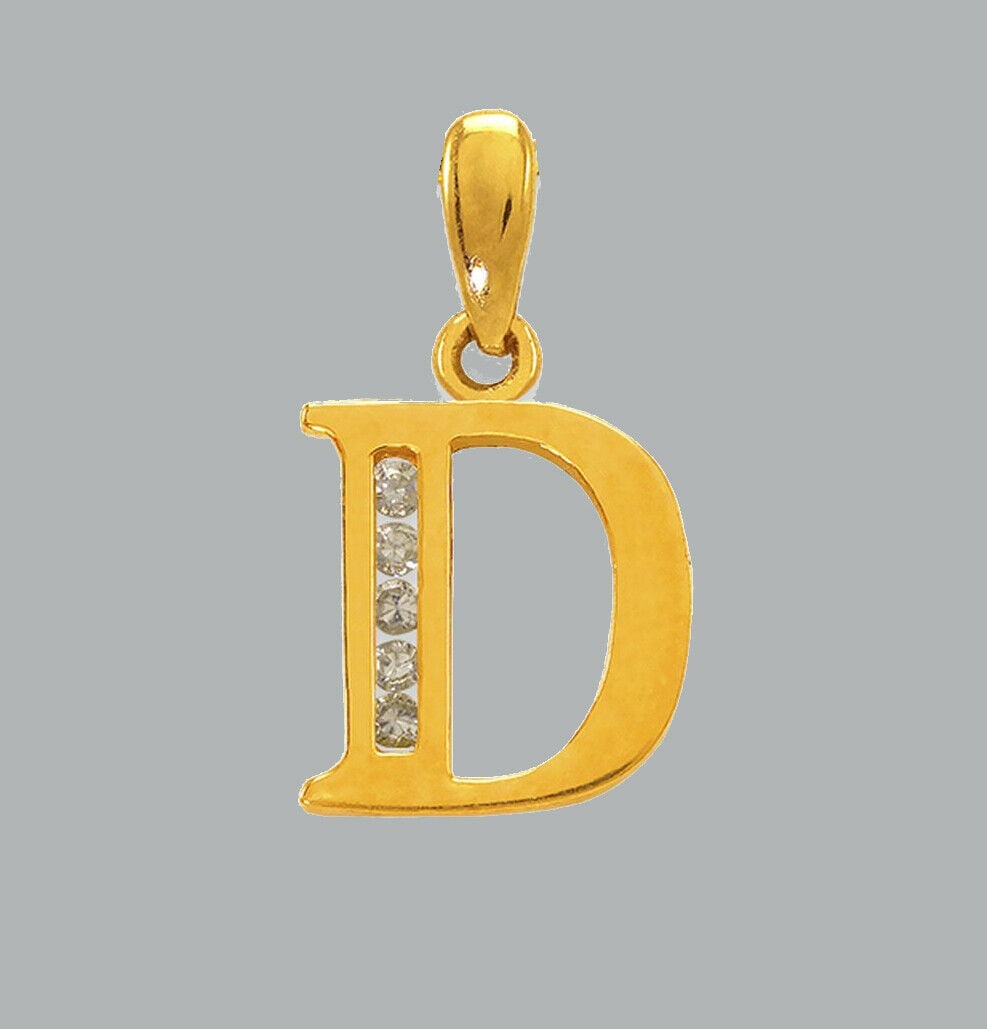 NEW 14K YELLOW GOLD CZ FANCY CHARM PENDANT INITIAL D: NEW 14K YELLOW GOLD CZ INITIAL PENDANT New 14K Yellow Gold pendant Pendant measures 8x10mm Set with cubic zirconia Polished finish Stamp: 14k Apx Weight: 0.7g