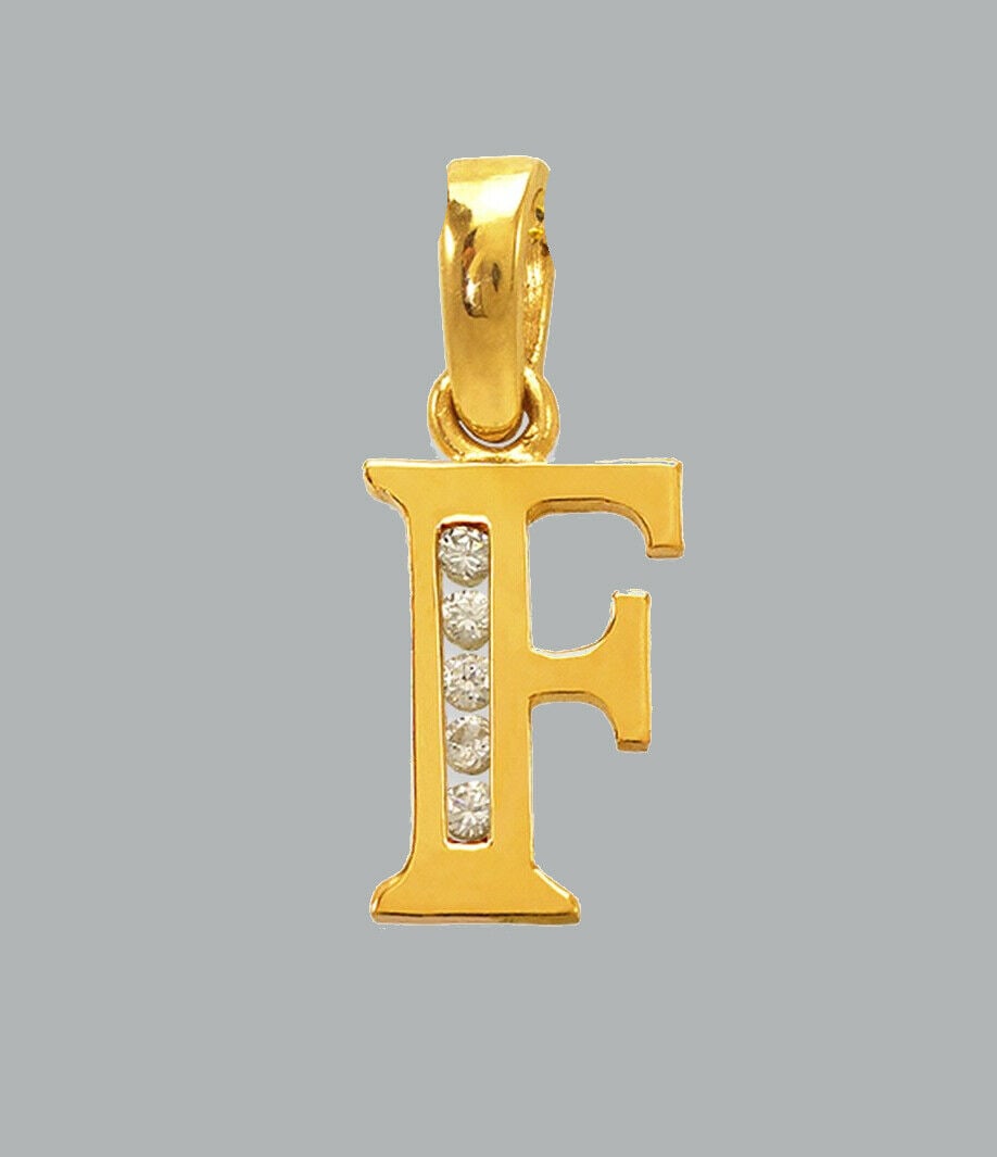 NEW 14K YELLOW GOLD CZ FANCY CHARM PENDANT INITIAL F: NEW 14K YELLOW GOLD CZ INITIAL PENDANT New 14K Yellow Gold pendant Pendant measures 6x10mm Set with cubic zirconia Polished finish Stamp: 14k Apx Weight: 0.7g