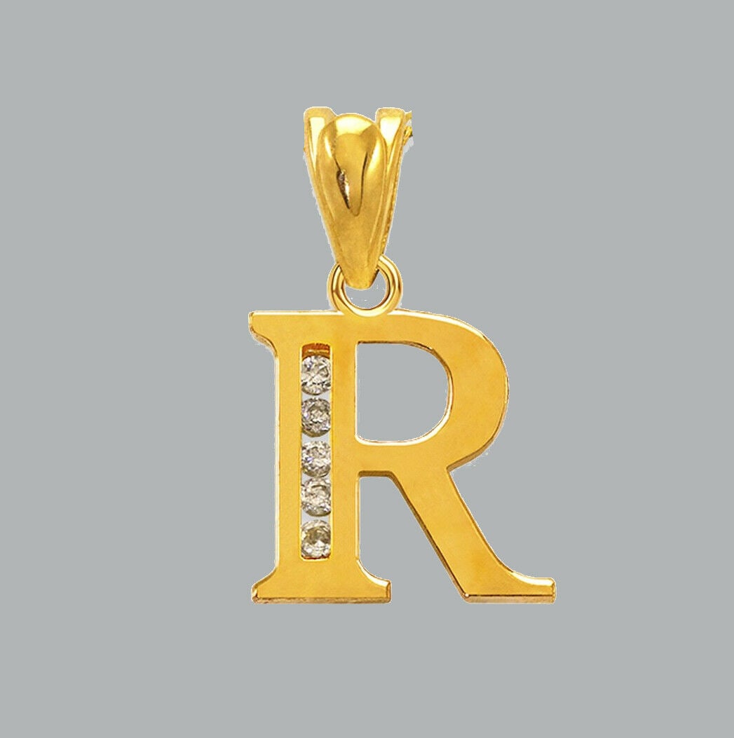 NEW 14K YELLOW GOLD CZ FANCY CHARM PENDANT INITIAL R: NEW 14K YELLOW GOLD CZ INITIAL PENDANT New 14K Yellow Gold pendant Pendant measures 10x10mm Set with cubic zirconia Polished finish Stamp: 14k Apx Weight: 0.7g