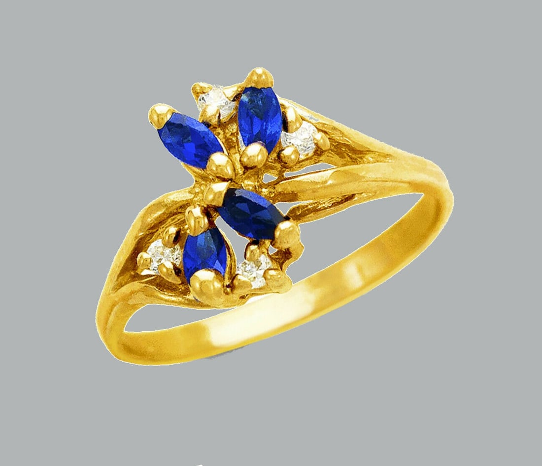 14K YELLOW GOLD LADIES FANCY CZ RING BLUE MARQUISE: NEW 14K YELLOW GOLD CZ RING New 14K Yellow solid gold ring Ring size 7 Measures 10mm wide on top Cubic Zirconia Polished Finish Apx Weight: 2.6g