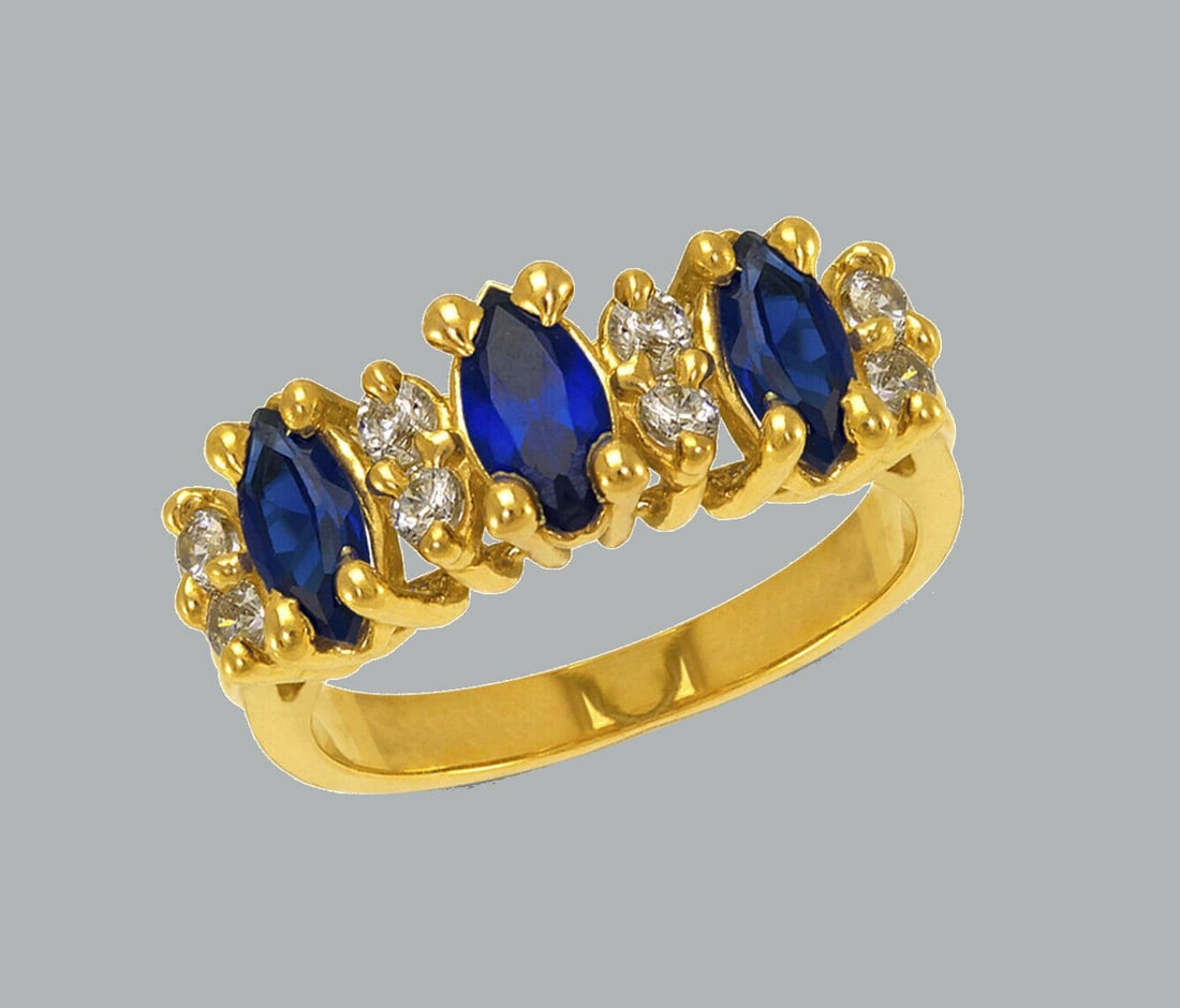 14K YELLOW GOLD LADIES FANCY CZ RING BLUE MARQUISE: NEW 14K YELLOW GOLD CZ RING New 14K Yellow solid gold ring Ring size 7 Measures 6mm wide on top Cubic Zirconia Polished Finish Apx Weight: 2.7g
