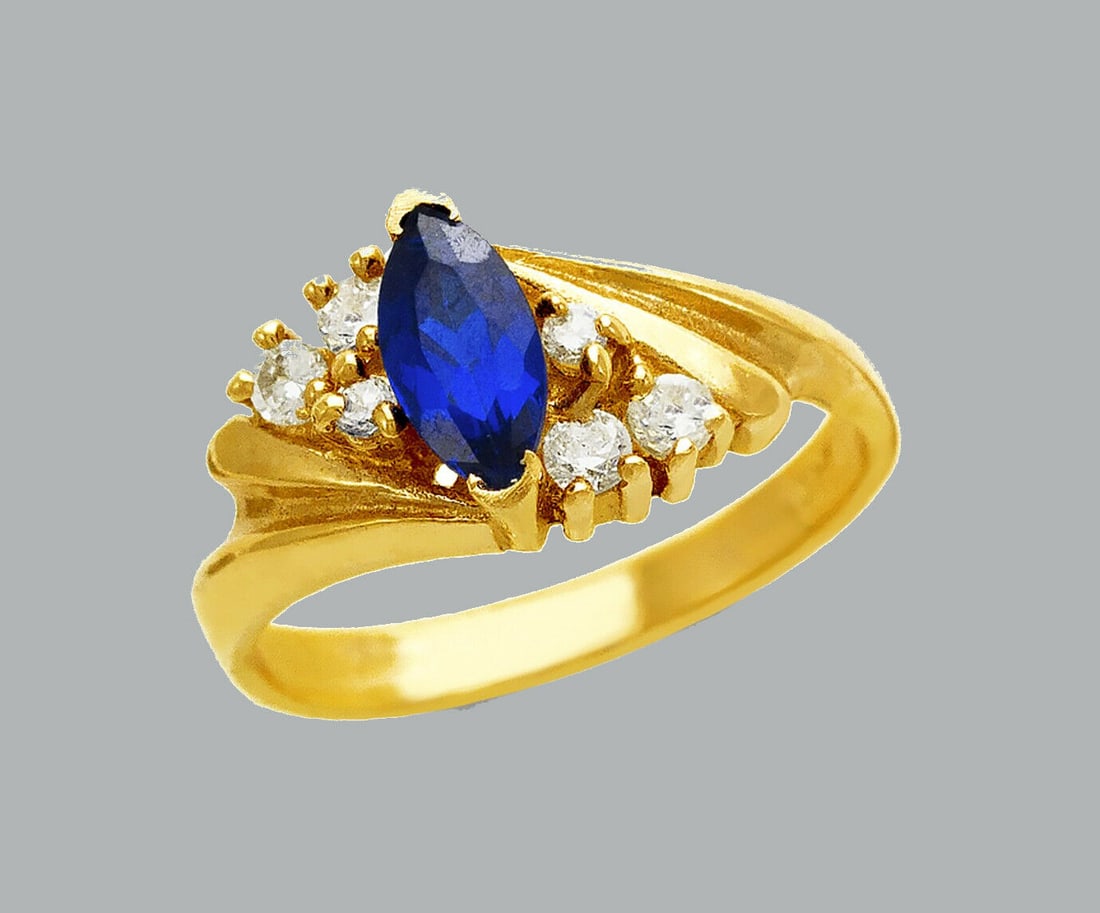 NEW 14K YELLOW GOLD LADIES FANCY CZ RING BLUE MARQUISE: NEW 14K YELLOW GOLD CZ RING New 14K Yellow solid gold ring Ring size 7 Measures 9mm wide on top Cubic Zirconia Polished Finish Apx Weight: 3.7g
